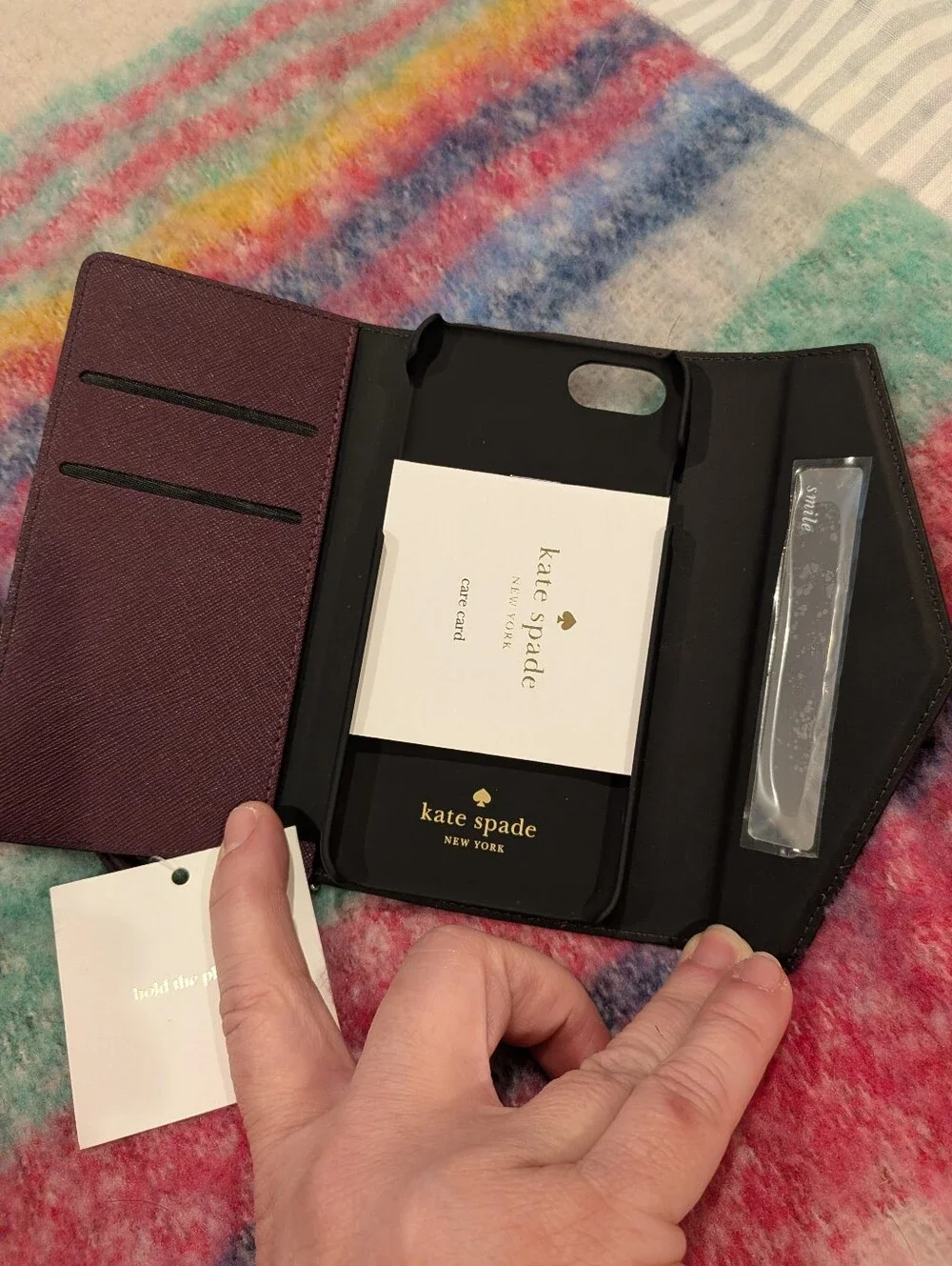 kate spade Plum Leather Wristlet Phone Case with Gold Logo